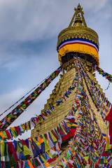 Portrait front view of Boudhanath Stupa and prayer flags. Kathmandu, Nepal. Boudha Stupa is one of the largest stupas in the world.