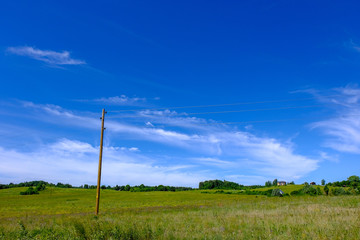 Obraz premium eletricity line poles and wires on blu sky