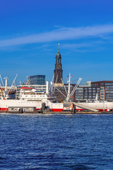 View of Hamburg harbor and downtown Hamburg, Germany, on a sunny afternoon.