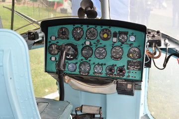 Cabin of a vintage soviet military helicopter, dasboard panel and steering stick, closeup - 240144987