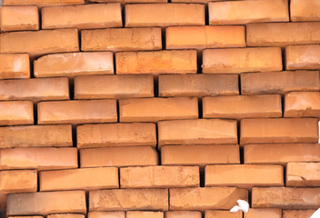 Obraz premium outdoor warehouse Wooden pallet of the red bricks covered snow on an another such pallet