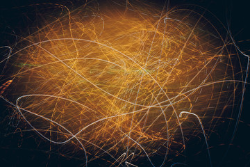 Abstract golden lines in motion on black background. Festive  energy concept.