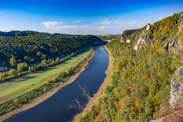 Fototapeta na wymiar View of the Saxon Switzerland National Park, Germany, (German: Nationalpark Sächsische Schweiz) with the river Elbe from the Bastei Mountain Range.