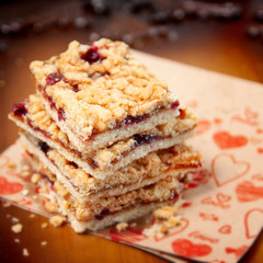 Homemade jam filled bar cookies on paper