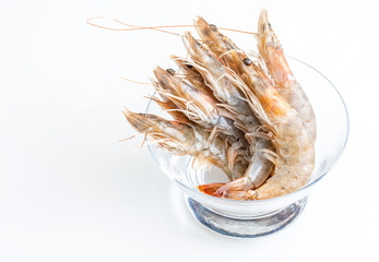 Close-up of fresh, raw and whole prawns. On white background.