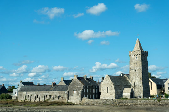 View of the Church Notre-Dame with fortified bell tower in Portbail. Normandy, France