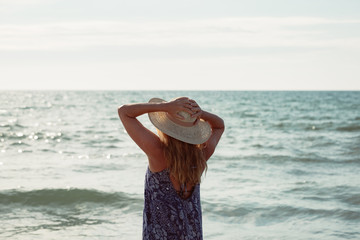 Rear view of middle aged woman on the beach