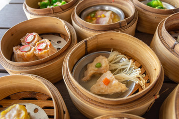 dim sum in bamboo steamer, chinese cuisine.