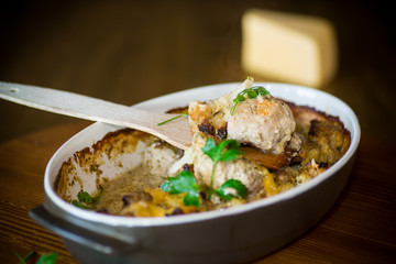 Cauliflower baked with meatballs in cheese sauce