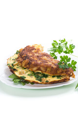 fried omelet with cauliflower and greens in a plate