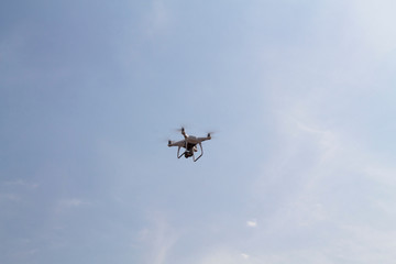 background of a quadrocopter drone flying in the sky