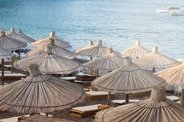 Cane sunshades on the sea beach
