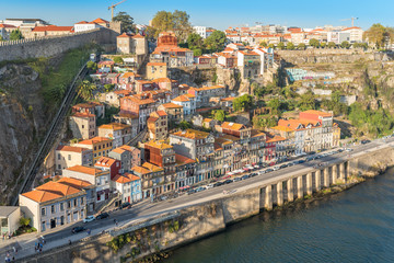 Fototapeta na wymiar Old town of Porto with the Guindais Funicular that leads to quay at Guindais