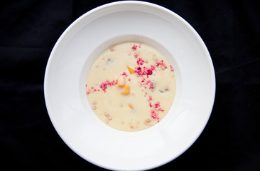 porridge on a white plate with colored dust