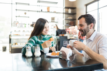 Man And Woman Spending Time In Cafe