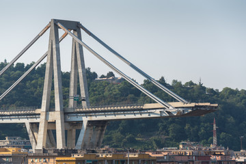 Fototapeta na wymiar Genoa (Genova), Italy, what is left of collapsed Morandi Bridge (Polcevera viaduct) connecting A10 motorway after structural failure causing 43 casualties on August 14, 2018