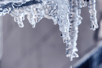 icicles sparkle against the sky and sunbeams b