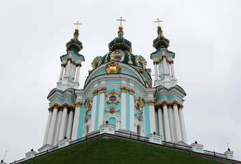 Fototapeta na wymiar View of St. Andrew's Church on the background of a cloudy sky in Kiev..