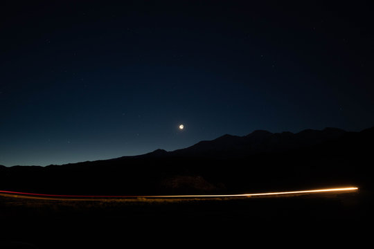 Photo of the Moon at night in the alpes