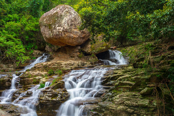 Balancing boulder in rainforest waterfall cascade macquarie rivulet australia