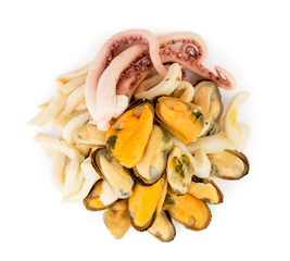 Heap of seafood mussels, octopus and squid on a white. The view from the top.