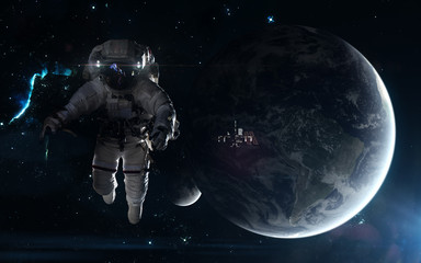 Obraz na płótnie Canvas Astronaut and ISS on the background of Earth and Moon. Star clusters, nebula. Science fiction art. Elements of the image were furnished by NASA