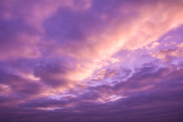 Naklejka na ściany i meble Beautiful nature background. Purple sky with clouds