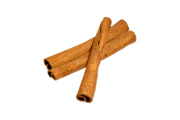 3 three cinnamon tubules lie side by side on a white isolated background with no shadows.