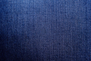 Fototapeta premium Dark Blue Denim Jean Fabric Concept and Idea of Denim Industry, Sewing and Fashion, Vintage Rustic Style. For Pattern, Background, Wallpaper and Textured