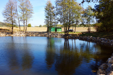Fototapeta na wymiar Natural pond in beautiful countryside