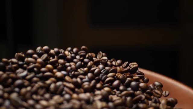 Roasted brown coffee beans group before grinder