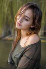 summer portrait of a swimming girl, emotional portrait of a girl in the water	