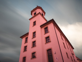 Church at Bavarian small village with stunning long exposure sky and quick cloud movement