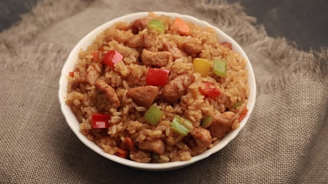 Video menu. The dish rotates on the table. Chahan fried rice with chicken rotates on table. Japanese Fried rice Chahan