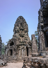 Bayon is remarkable for the 216 serene and smiling stone faces on the many towers jutting out from the high terrace and cluster around the central peak