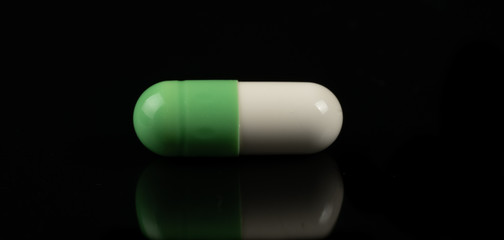 pills on black  background