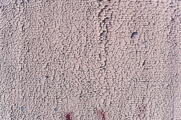 Peeling paint on an old canvas. Texture