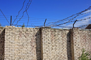 Wall with barbed wire