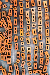 Bricks laid out on stone tiles on the street. Texture