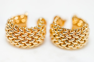Obraz na płótnie Canvas yellow gold hoop earrings - Image