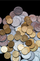 Small Ukrainian coins isolated on black background. Close-up view.