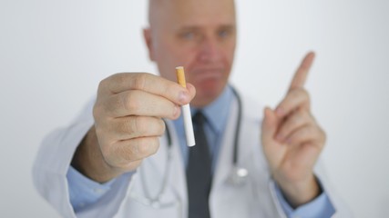 Doctor Showing a Cigarette and Making a Disagree Hand Gestures a No Finger Sign