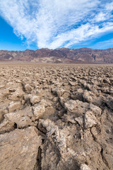 Salt formations under a blue sky at the Devil's Golf Course in Death Valley National Park, California, USA