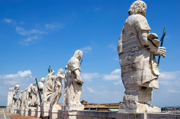 Fototapeta na wymiar Rome / Italy - April 24 - 2015 : The sculpture at the roof of Saint Peter's Basilica