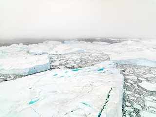 Fototapeta na wymiar Aerial view of Arctic Icebergs in Greenland