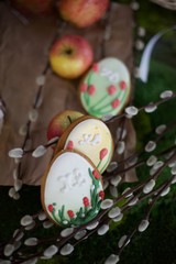easter eggs in basket on wooden background