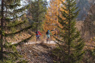 Two people on mountain bikes in  the Fanes Sennes Prags Nature Park near Schluderbach Carbonin in the South Tyrol, Italy.