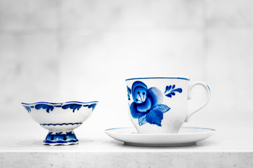 dishes and decorative elements painted in the style of Gzhel, tea, coffee 