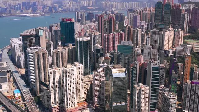HONG KONG - MAY 2018: Aerial view of Causeway Bay district on Victoria Harbour, residential and business skyscrapers.