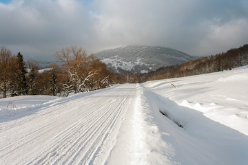 Fototapeta na wymiar Snowy road in Bieszczady, Bieszczady Mountains, Bieszczady National Park, Carpathians Mountains, Poland